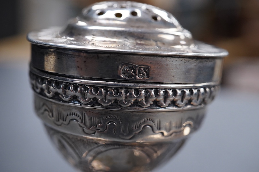 A George III silver octagonal nutmeg grater by Phipps & Robinson, London, 1810, 46mm(a.f.), together with a George III silver pedestal pepperette, by Alice & George Burroughs, London, 1808, 70mm.
